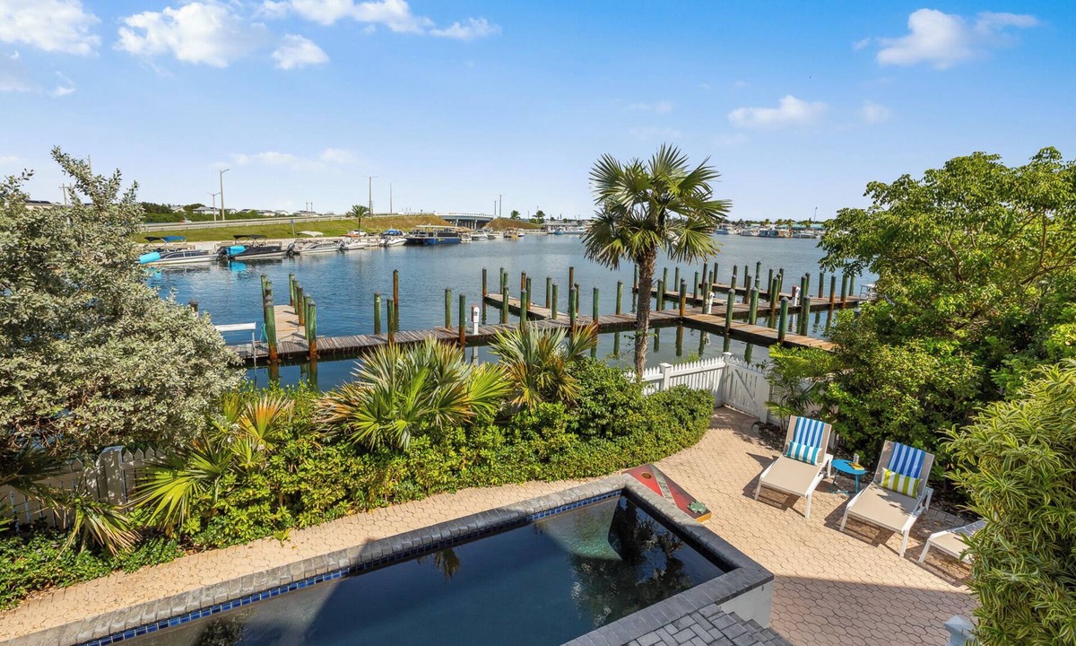 Meadows House | SEVENTH HEAVEN~Waterfront 5 BR, 4 Ba Townhome with Pool, Elevator & Dockage!
