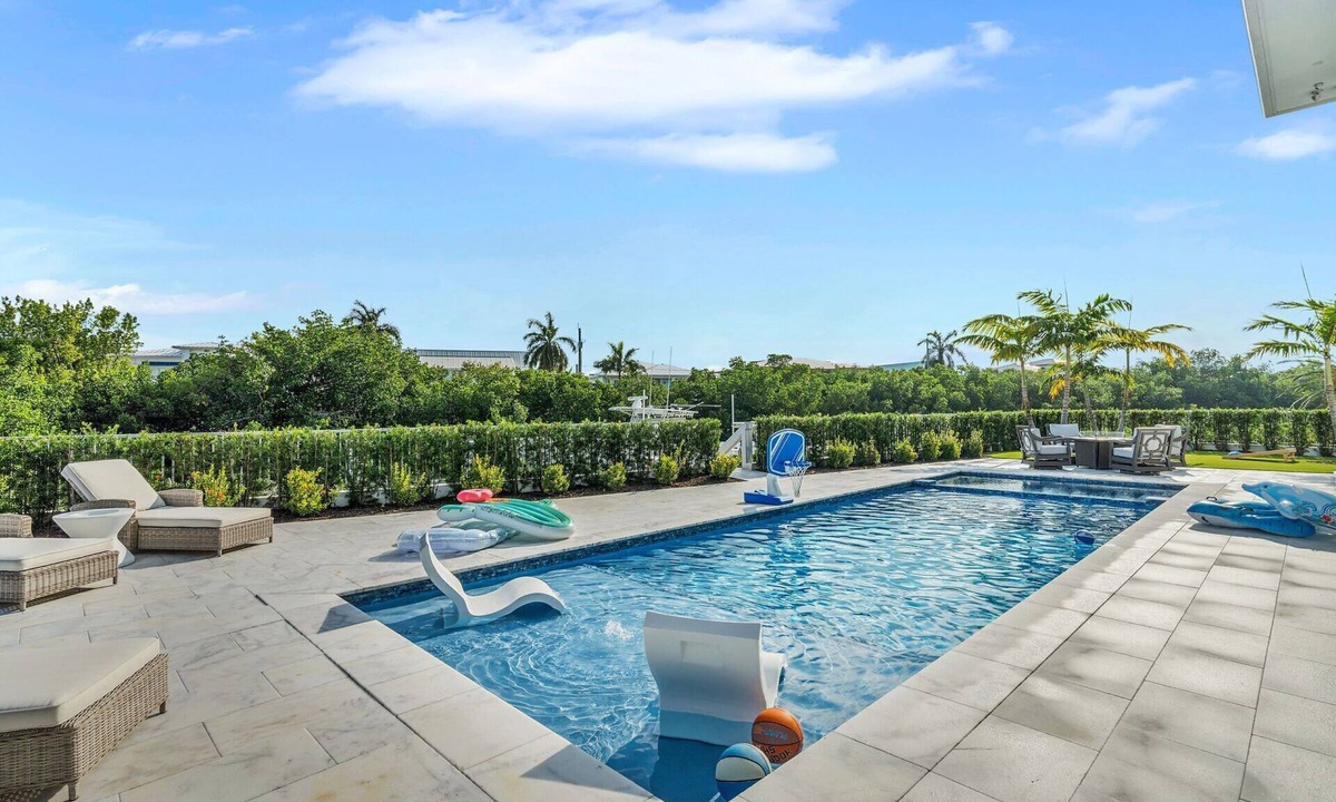 Coury House | Sophisticated 5-bedroom, elevator, 50' dock, heated pool/spa, kayaks, sleep 12