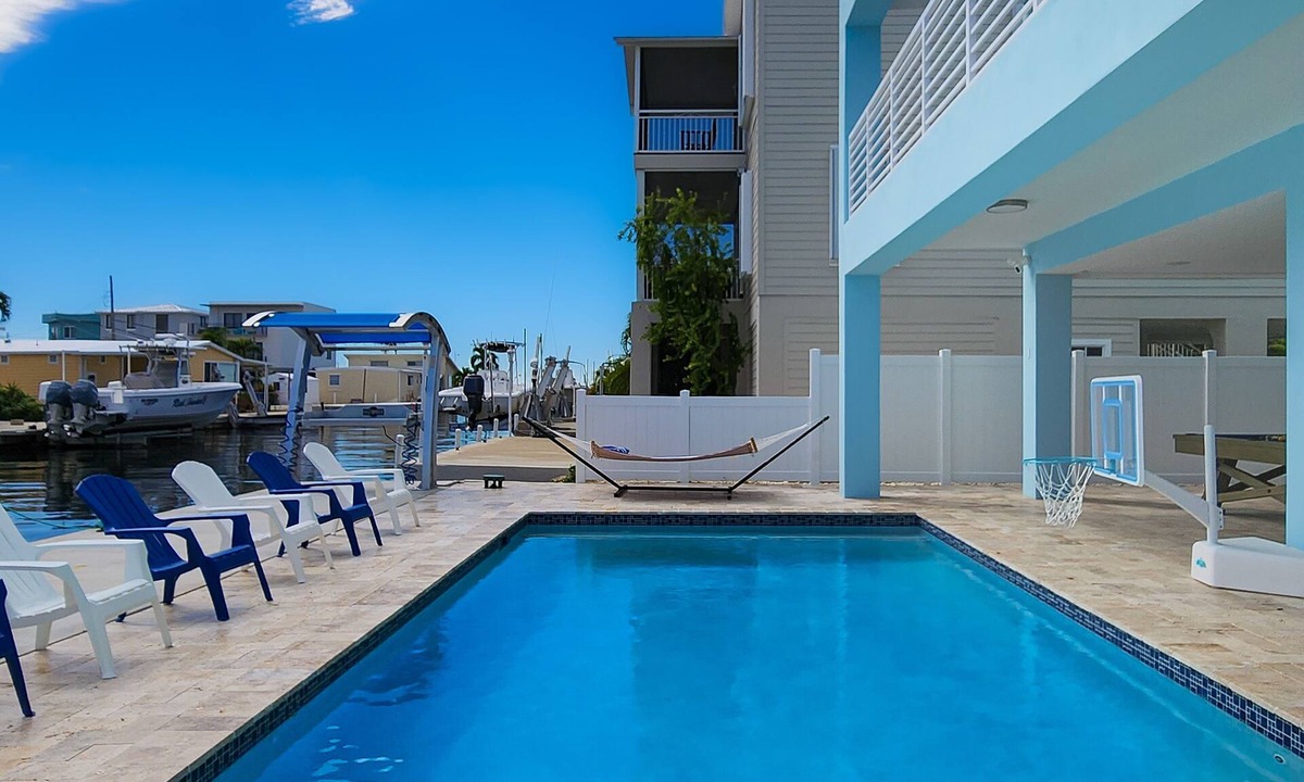 Sexton Cove Estates House | Sprawling waterfront home with pool, outdoor kitchen, game table, grill, & W/D