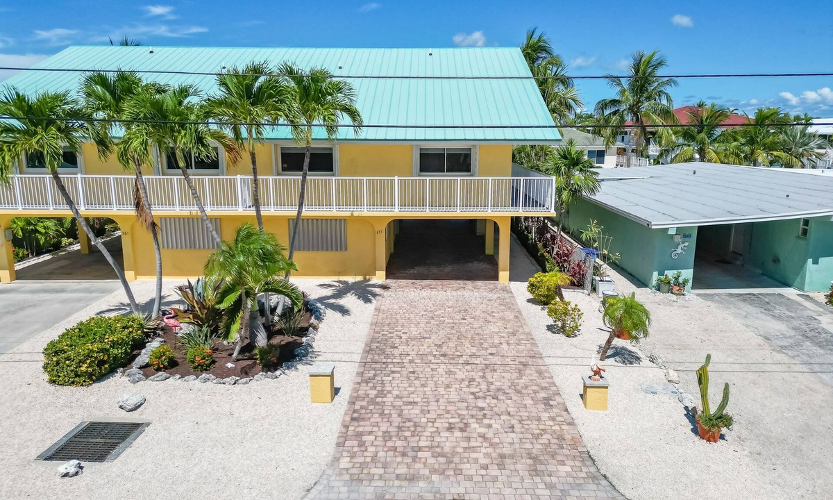 Key Colony Beach House | Waterfront home with dock, filet station, patio, balcony, & Cabana Club access
