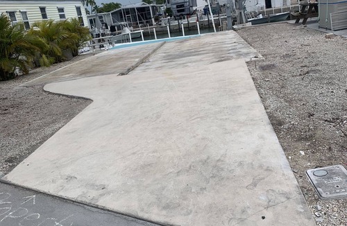 Cudjoe Key Resort | 35'x70'WF RV Site on canal for rent for RV owners. Pet friendly gated community.