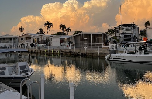 Cudjoe Key Resort | 35'x70'WF RV Site on canal for rent for RV owners. Pet friendly gated community.