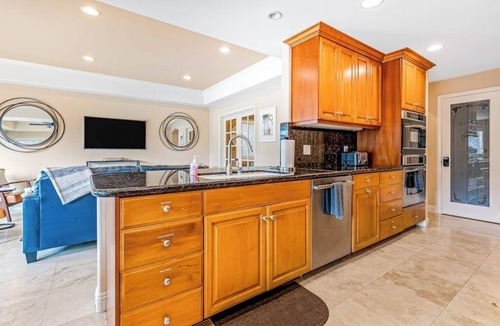 Naples House | Bright home on the channel with expansive patio & elevator