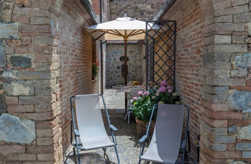 Cetona Apartment | Cozy flat with pool and cypress view in Cetona