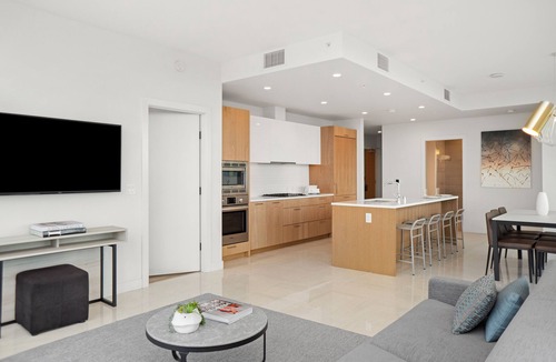 Downtown Los Angeles Apartment | Enjoy corner city views with two king beds and two bathrooms.