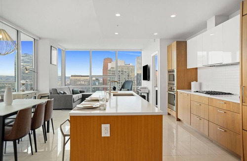 Downtown Los Angeles Apartment | Enjoy corner city views with two king beds and two bathrooms.