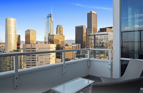 Downtown Los Angeles Apartment | Enjoy corner city views with two king beds and two bathrooms.