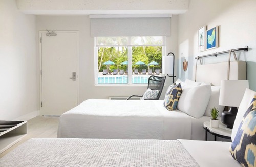 New Town Hotel | Island Charm & Retro Fun | Pools, Comfort Eats, Shuttle & Fire Pits