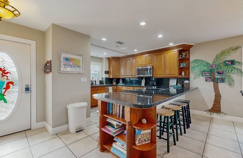 Cutthroat Harbor Estates House | Ocean-view snowbird retreat with private pool, rooftop, lanais, kayak & bikes