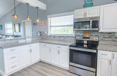 Port Pine Heights House | PADGETT PARADISE with Two Boat Slips with Filet Table. POOL