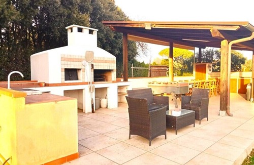 Castiglione della Pescaia Villa | Portion of villa with large garden and beautiful barbecue area 5 minutes from the sea