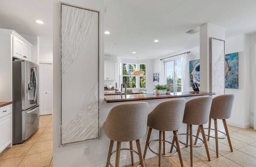 Meadows House | SEVENTH HEAVEN~Waterfront 5 BR, 4 Ba Townhome with Pool, Elevator & Dockage!
