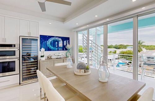 Sexton Cove Estates House | Sprawling waterfront home with pool, outdoor kitchen, game table, grill, & W/D