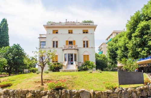 Quinto al Mare Villa | The Riviera apartment, located on the ground floor of Villa Aranci in Via Fabio Filzi 2B, Genoa, offers an elegant and comfortable stay in an exclusive setting.With a private entrance, double bedroom, living area, private bathroom, and direct access to t