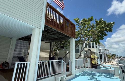 Cudjoe Key House | TWO HOMES A MID Rise and High Rise 85ft of Sea Wall.