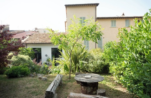 Foligno House | Umbria Hideout Villa surrounded by a green view from the garden through the hill