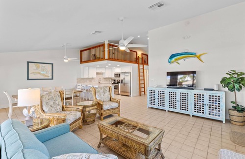Key Colony Beach House | Waterfront home with dock, filet station, patio, balcony, & Cabana Club access