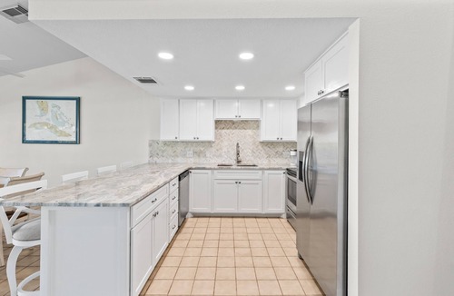 Key Colony Beach House | Waterfront home with dock, filet station, patio, balcony, & Cabana Club access
