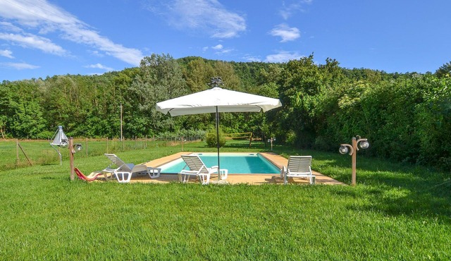 An original cottage in an old mill with large fenced garden and private pool.