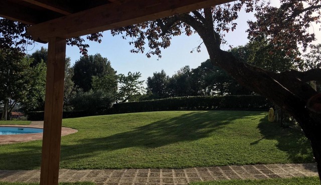 Apartment with garden in Villa with swimming pool