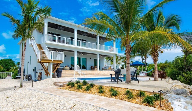 Brand New Single Family 5/5 -90ft dock, pool, paddle boards, bicycles plus more!