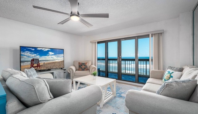 Direct oceanfront corner with private balcony, heated beachfront pool and garage parking in Ormond Beach