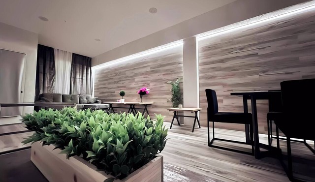 “Elegant Condo Steps from Americana”