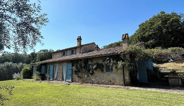 Stone farmhouse nestled in the Umbrian countryside