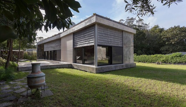 Villa with modern minimalist architecture in the middle of a nature reserve