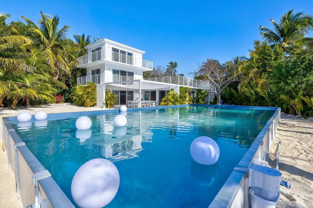 Rock Harbor Villa | Modern ocean side estate: 5 bed - 6 bath, big pool, 2 rooftops, small dock