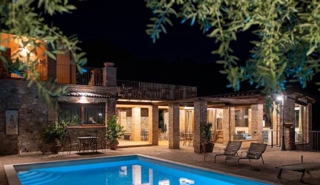 In the charming Umbrian countryside near Orvieto, villa with pool and waterfall.